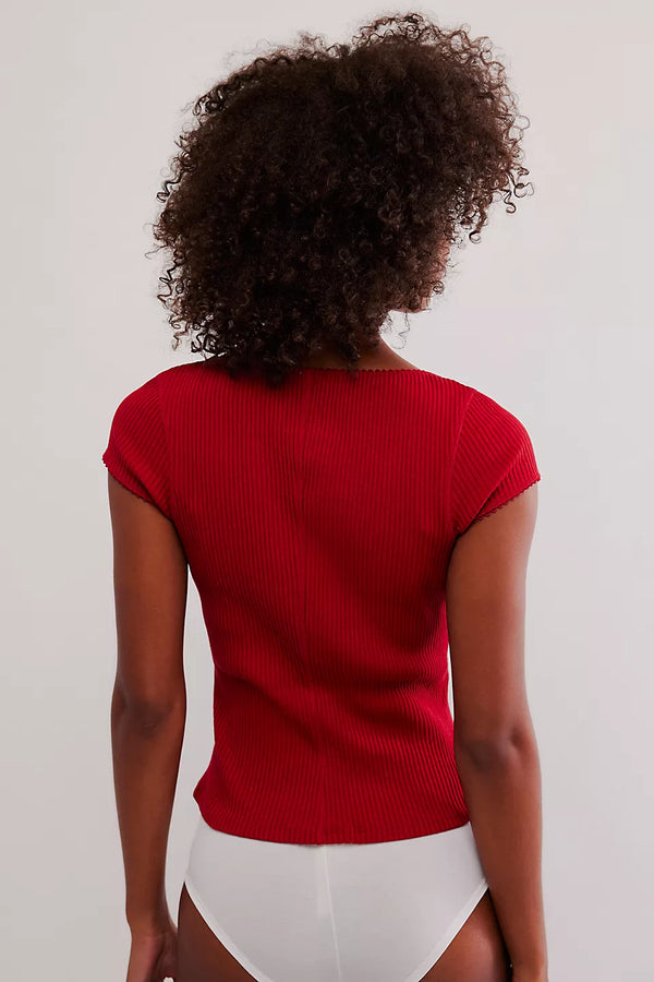 shows model wearing the ribbed detailing, the red color and the picot trim. 