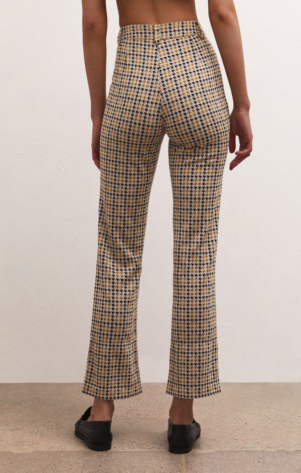 back view of the pastor houndstooth pant in spiced rum. shows the high waist. also shows the belt loops, the slim fit and the straight leg.