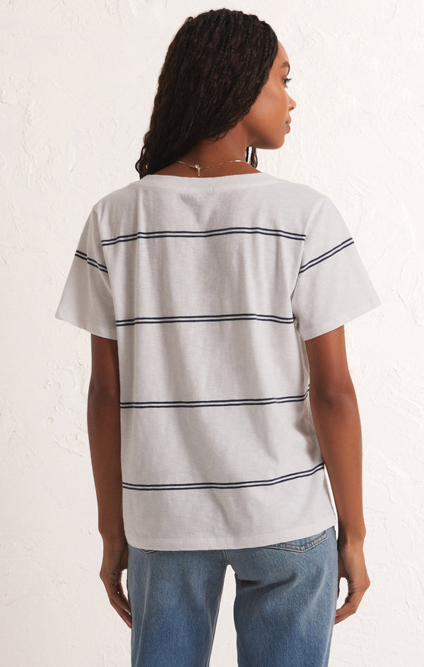 back view of the model wearing the girlfriend twin stripe v neck. shows the relaxed fit. also shows the twin stripes throughout and the short sleeves. 