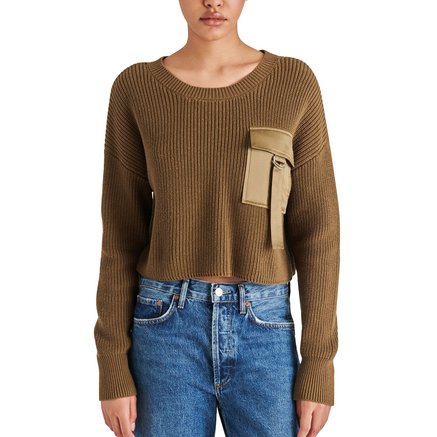 front view of model in sweater. shows cropped length, crew neckline, dropped shoulders and cargo pocket on the front.