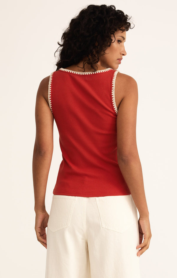 back view of the model wearing the jaidynn rib tank. shows the full length tank. also shows the red color, the ream stitching, the ribbed detailing and the fitted look.