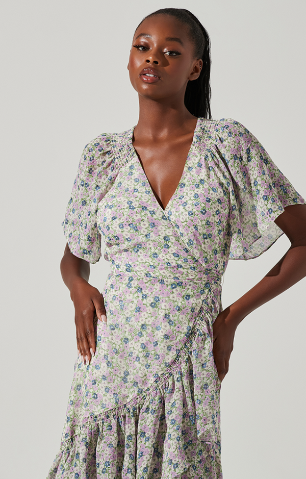 Closer view of the front v-neckline, flutter sleeves and crossover detail.