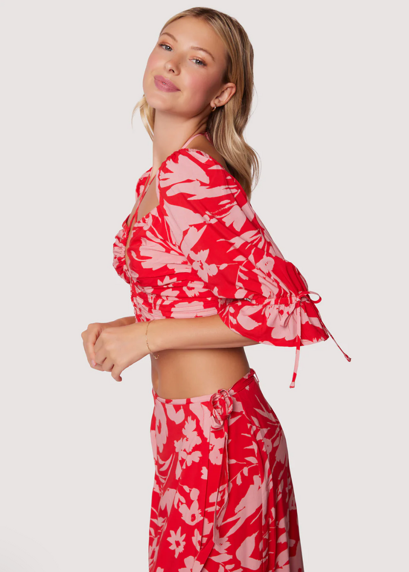 Side view of top. Showcases the sleeves that come down to the models elbow.