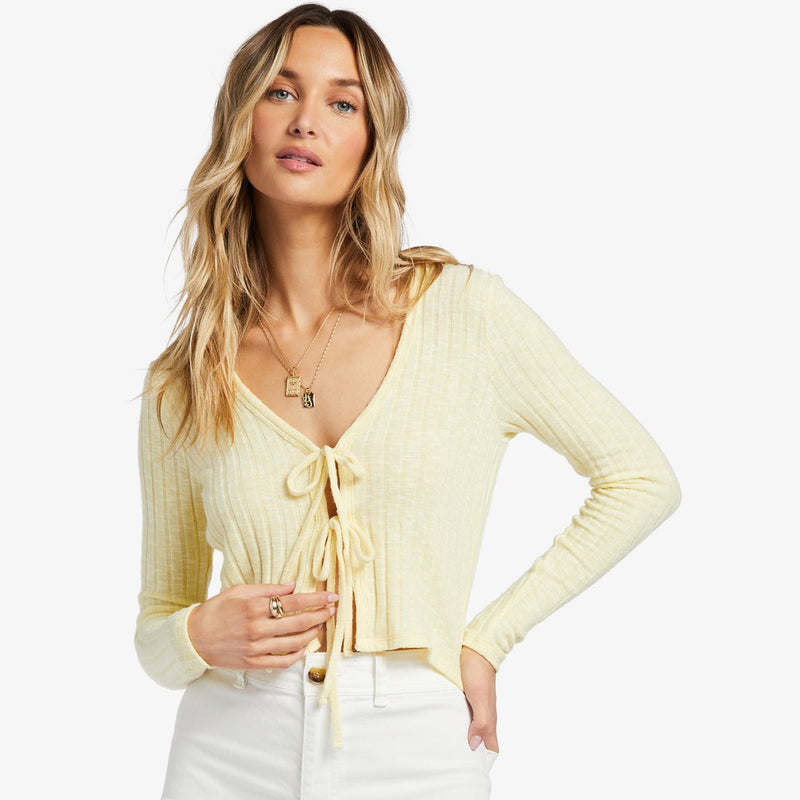 shows front view o cardigan featuring two front tie closures, a v neckline, and a cropped silhouette. 