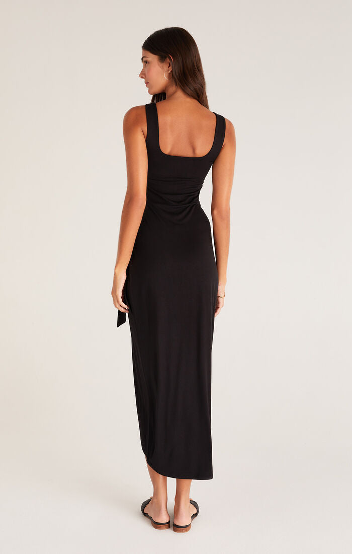 shows back view of dress featuring square back, wide straps, 